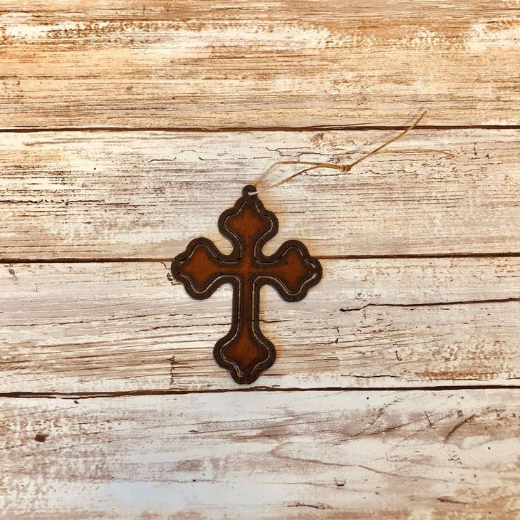 Rustic metal cross ornament with cutout design for religious wall or tree decor