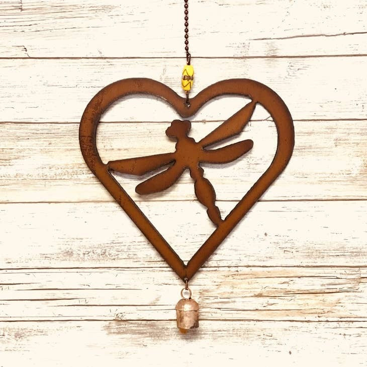 Rusty metal bell chime with heart outline and dragonfly mobile accent