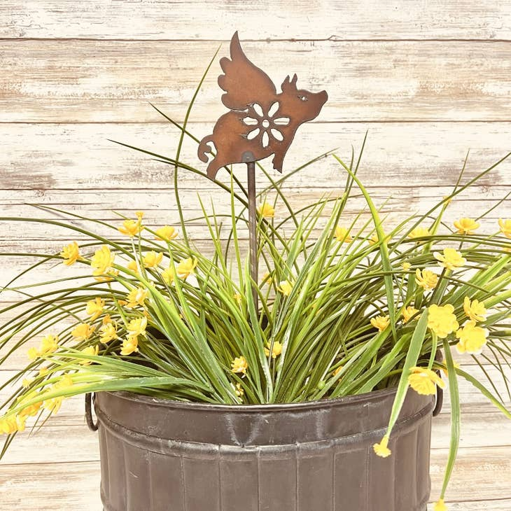 Flying pig garden plant stake in rustic metal finish