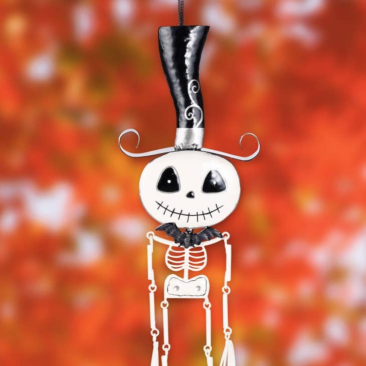Bouncy skeleton figure with smiling face for Halloween hanging decor