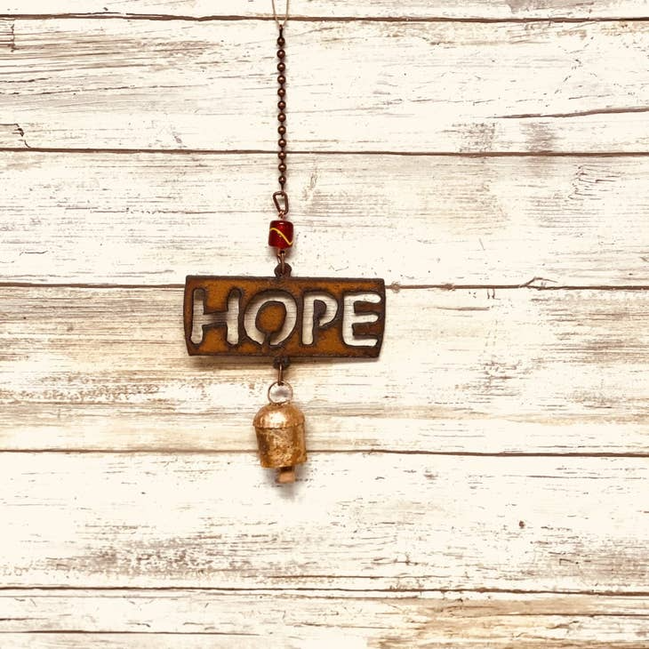 Rustic garden bell chime with inspirational “Hope” message