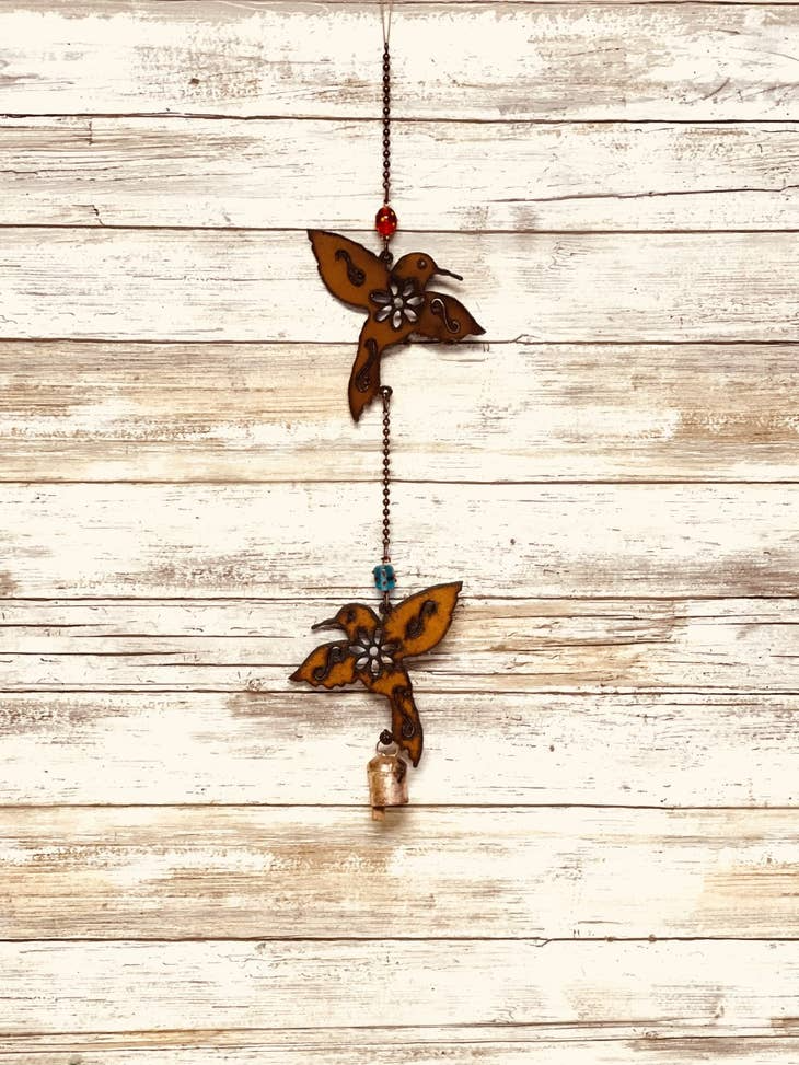 Rustic metal garden chime with two bells and hummingbird accent